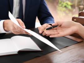 California business owner reviewing a high-value agreement with legal counsel before signing