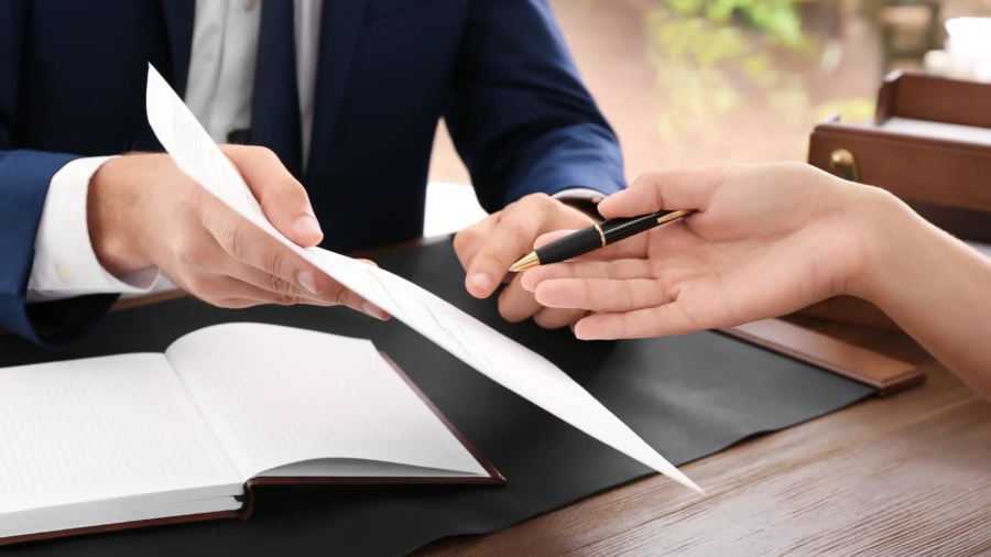 California business owner reviewing a high-value agreement with legal counsel before signing